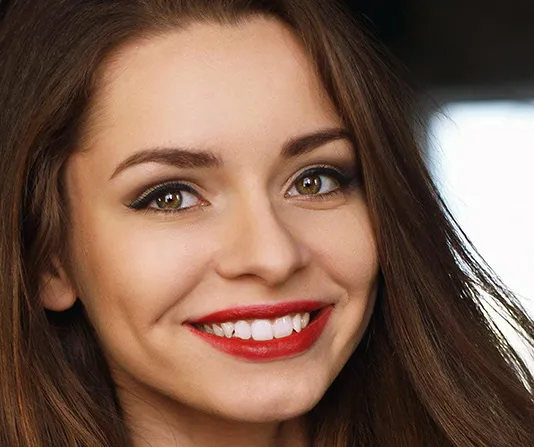 Beautiful dental patient showing new crowns
